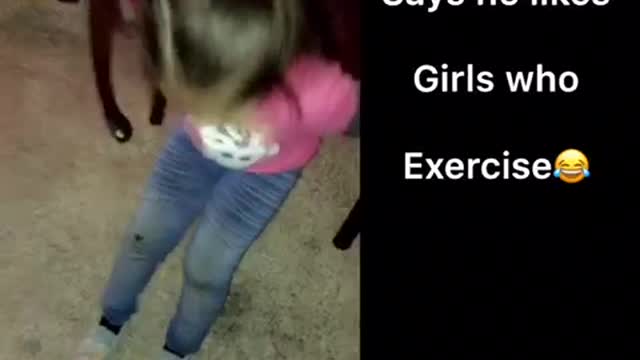 Little girl in pink does different exercises