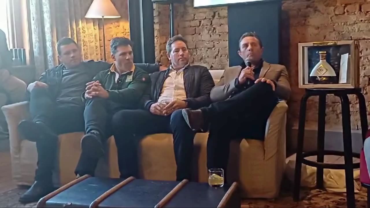 Rugby icons chat over a glass of brandy