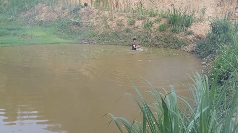 fishing and burning fish in the pond