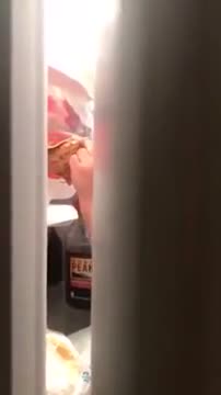 Little Kid Is Caught On Camera Nibbling Chicken From Fridge!