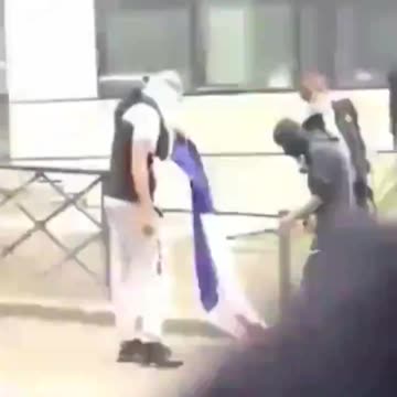 Muslim immigrants burn the French flag in France.