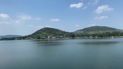 blue sky and white clouds, mountains and sea