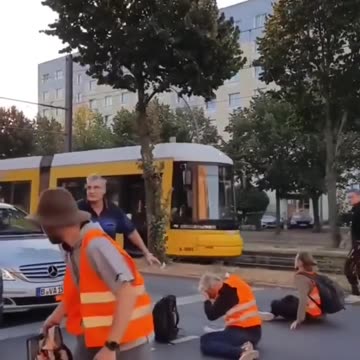 European pepper sprays mentally ill climate protestors blocking traffic.