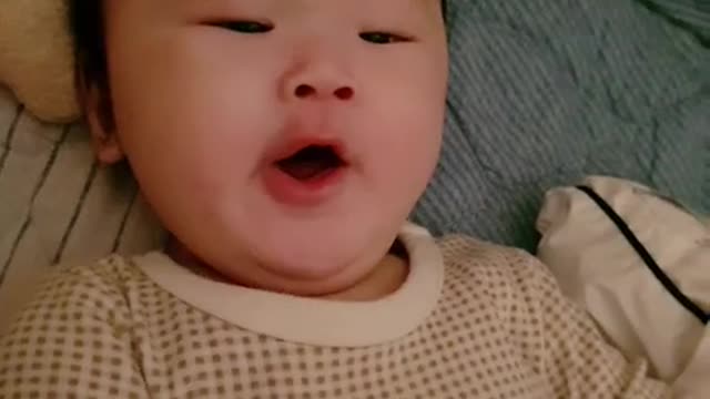 Smiling and Yawning Baby