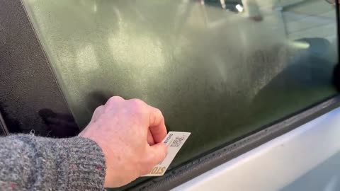 Putting a business card on car windows