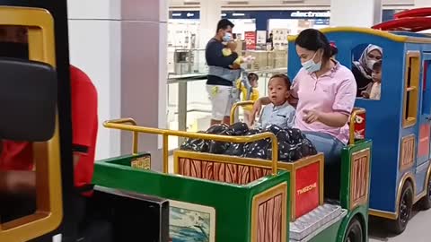 Little boy playing train