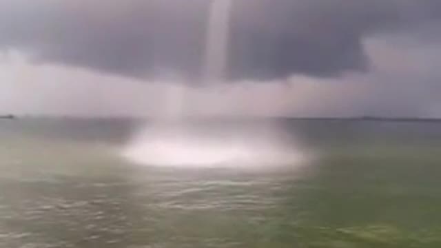 Form a waterspout on the sea, natural landscape