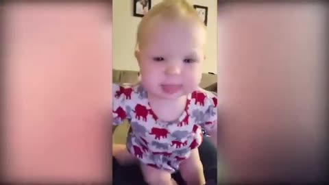 Lovely baby laughing and playing with joy