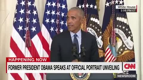 Barack Obama gives a speech after the unveiling of his White House portrait