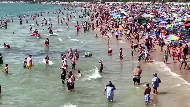 Brits flock to Bournemouth beach as temperatures soar