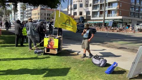 The 10 bad bills Santa Monica Pier CA Peaceful protestors hand out info.