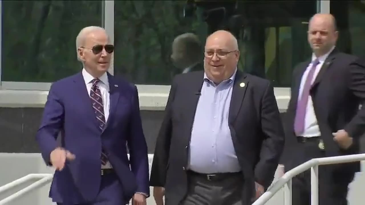 Biden walls down a ramp
