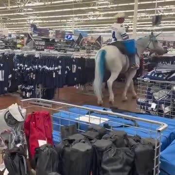 Dude rides a horse inside Walmart
