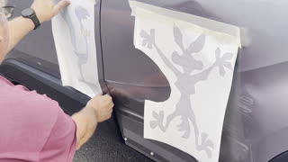 Car Damage Decorated With Looney Tunes Stickers