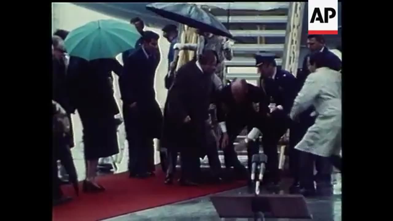 President Ford 1975 falls down plane steps. Looks like wet steps & no handrail use