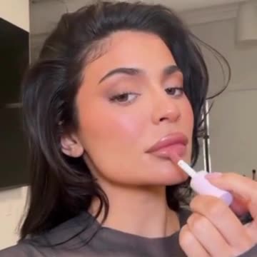 Kylie Jenner flaunts her famous pout while promoting her makeup