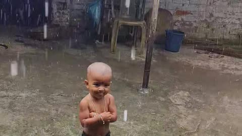 BABY ENJOYING RAIN