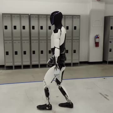 The Tesla Optimus Robot Getting Its Daily Steps in