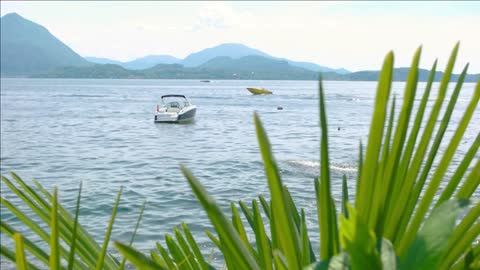 water boat and mountains italy in summer scenic view fishing destinations in europe