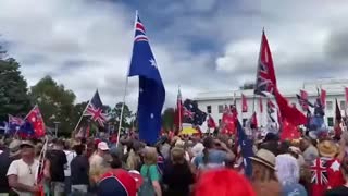 Crowd sings the Australian Anthem At Canberra Parliament House Australia stopping Draconian Rule