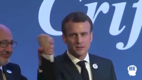 Macron with a fake hand