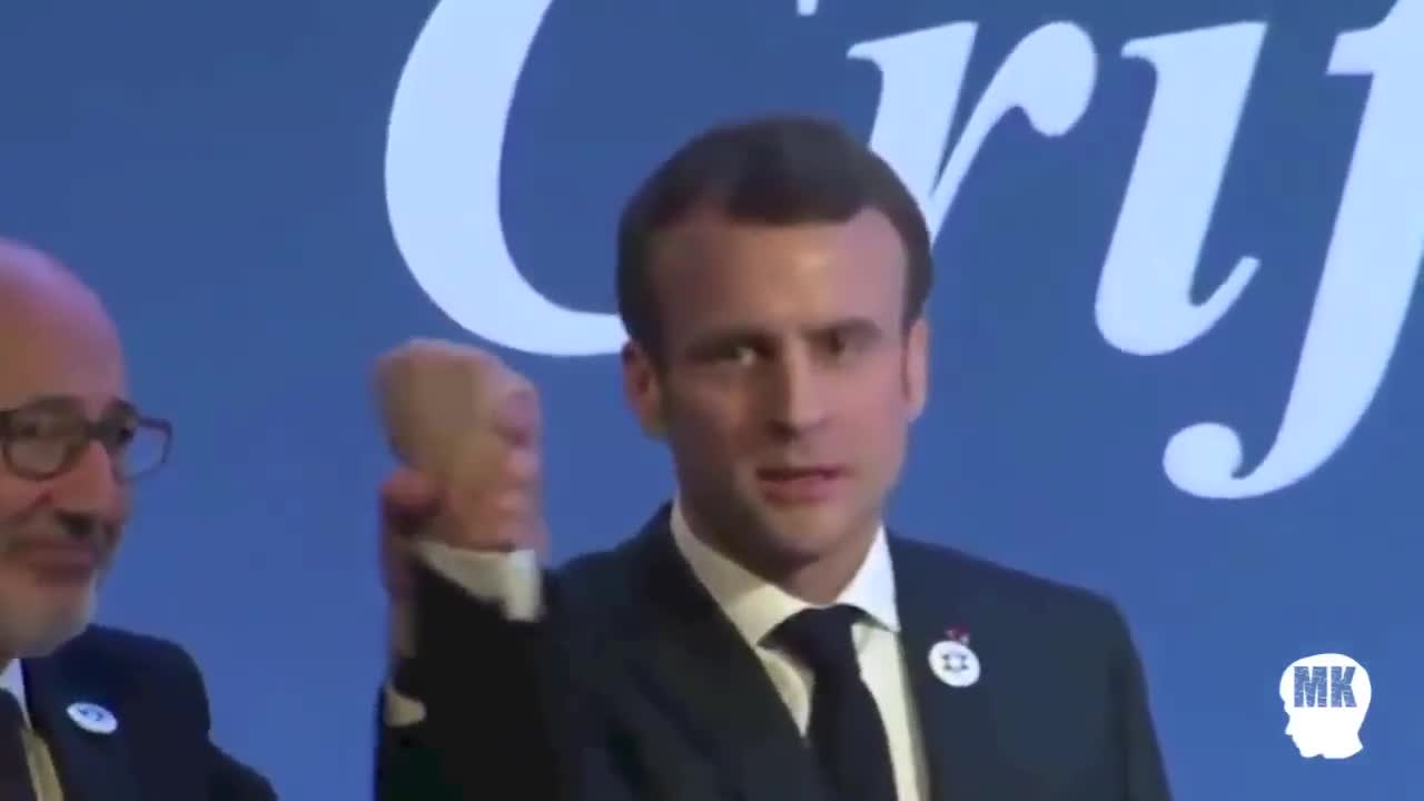 Macron with a fake hand