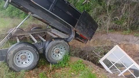 Using our dump trailer to haul and dump yard debris