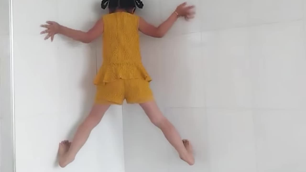 Girl climbs a wall!