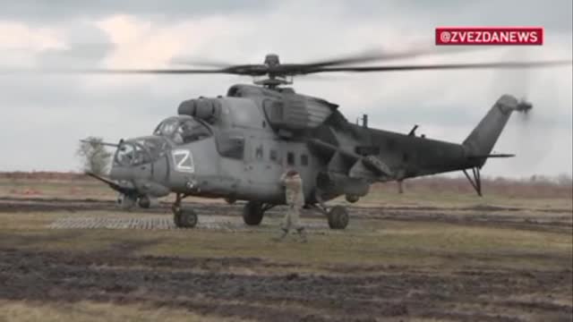 Footage of a Russian Air Force Mi-35 helicopter striking enemy positions