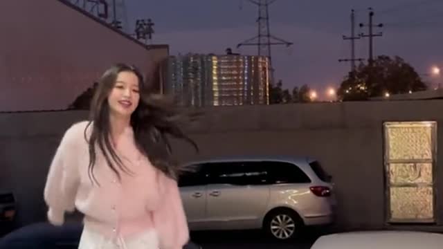 A beautiful Asian girl, dancing a lovely dance