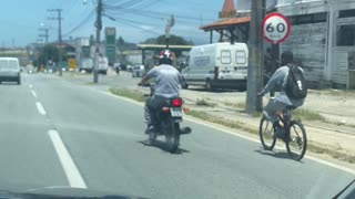 Bicyclist Being Towed by Motorcyclist Takes a Tumble