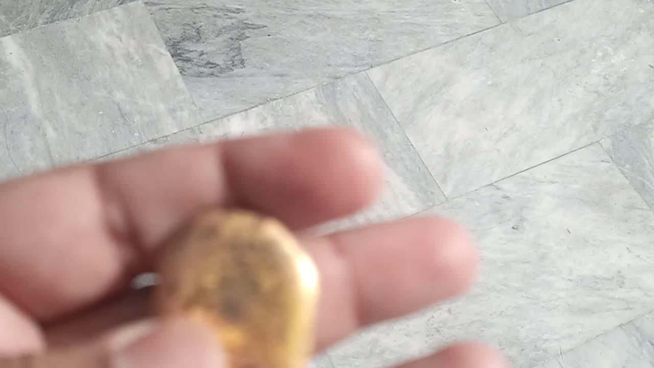 A piece of solid gold melt.