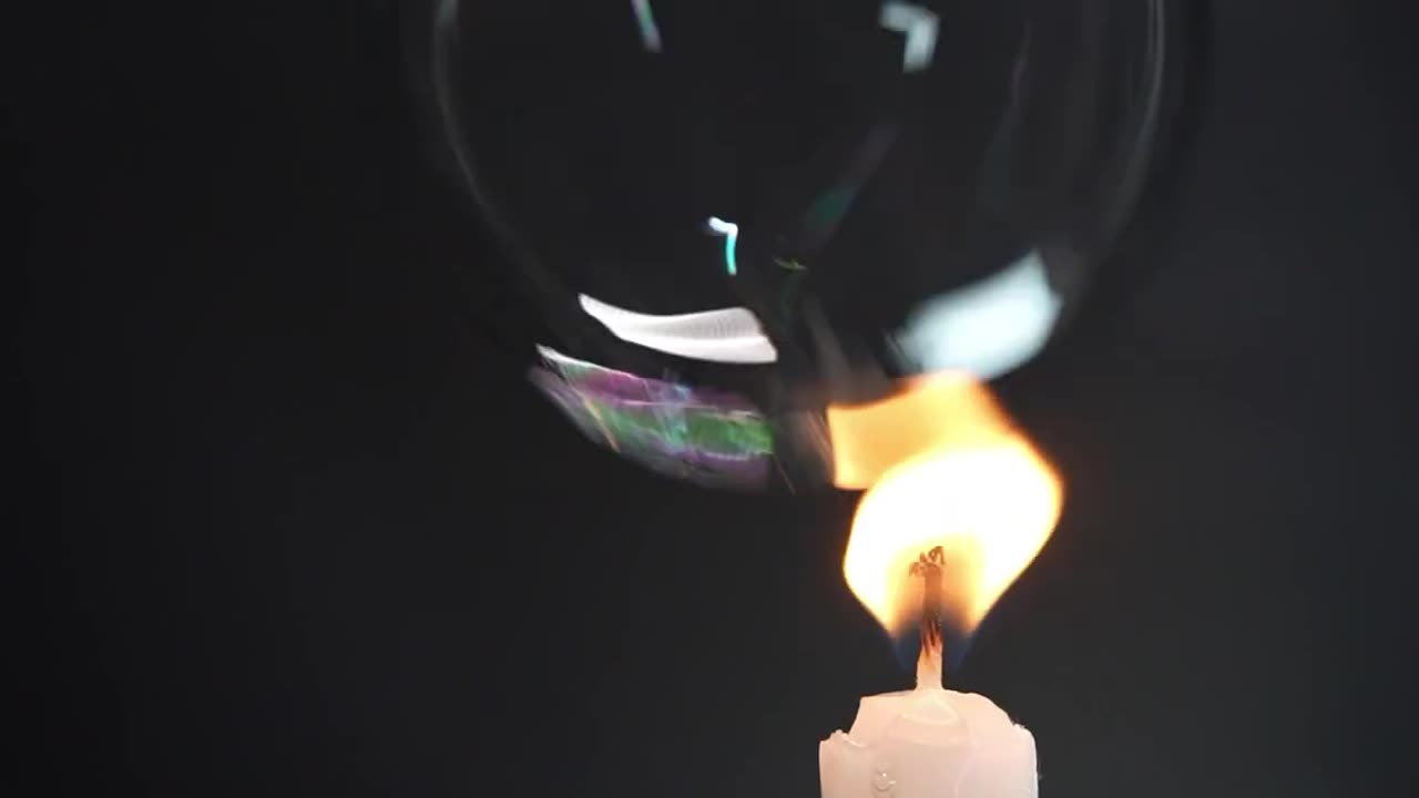 Popping Bubbles with a Candle