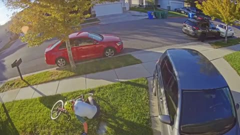 Person Falling on Grass Trying to Get off Bike