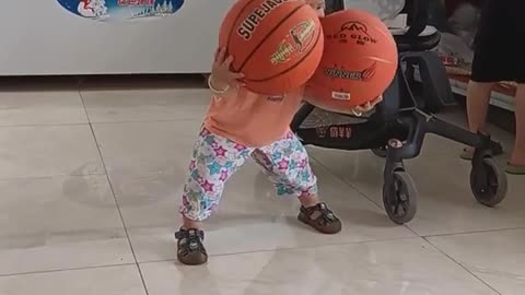 Young child playing basketball