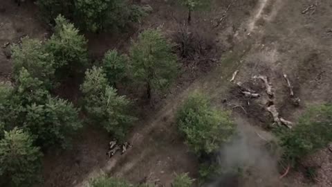 POV from RF UAV of UAF being shelled and trying to save their comrade