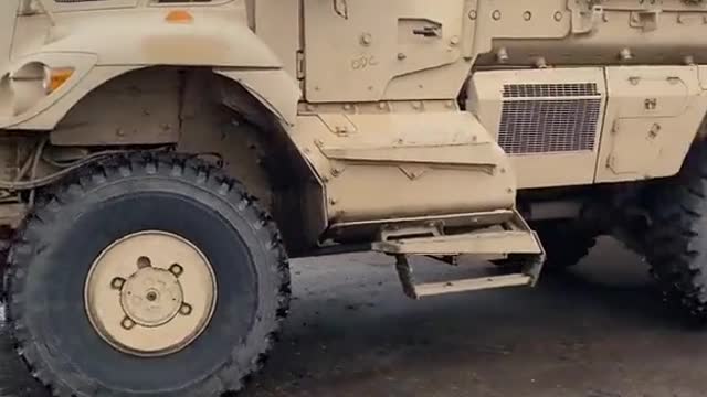 Ukrainian servicemen try to figure out how to hide NATO equipment in a shed