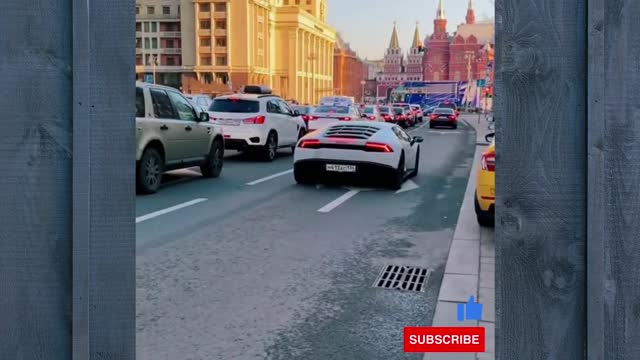 White Lamborghini on road with heavy driver