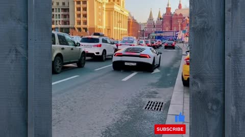 White Lamborghini on road with heavy driver