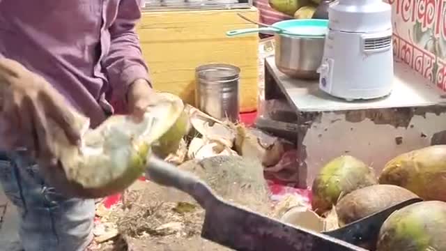 Dangerous cuting of coconut