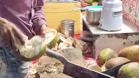 Dangerous cuting of coconut