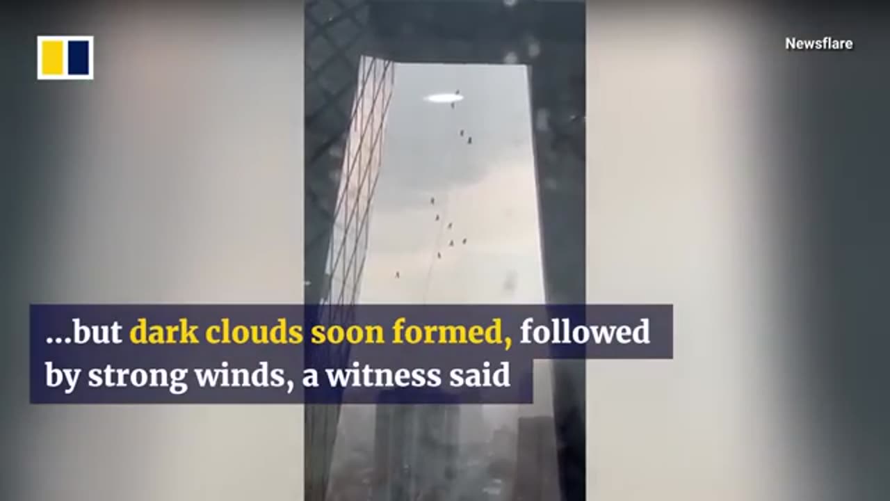 Windstorm leaves window cleaners dangling off skyscraper