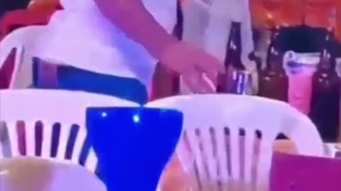 Drunk man in a party takes beer Home in a plastic bag