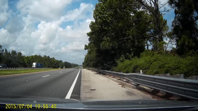 Rogue Tire Slams Approaching Car