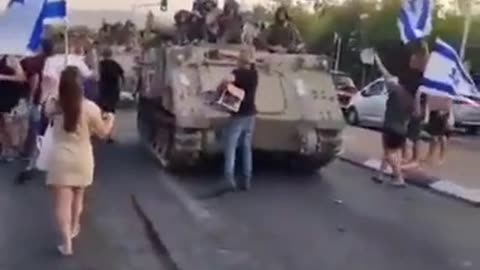 Israeli citizens saying goodbye to soldiers who will soon enter Gaza.