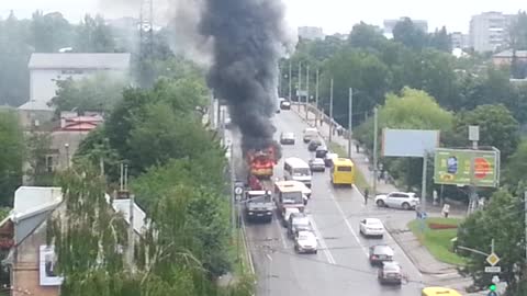 Flaming Trolleybus Rolls Through Crowded Streets Of Lviv