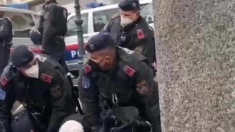 Vienna: Austria. Communistic police take out a 'elderly lady'