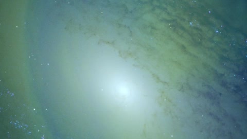 Abstract video superimposed on a large galaxy