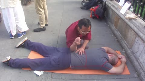 Luodong Massages Tall Bald White Man On Sidewalk