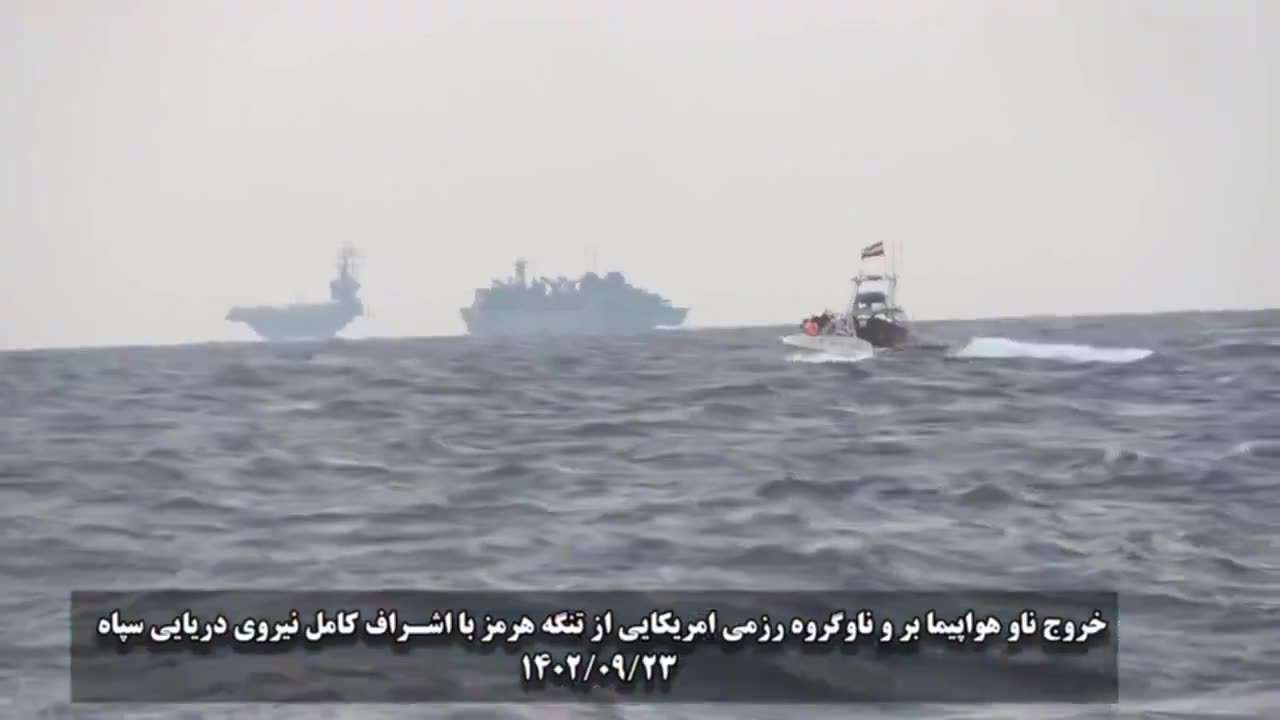 Encounter between a US aircraft carrier and an Iranian warship.